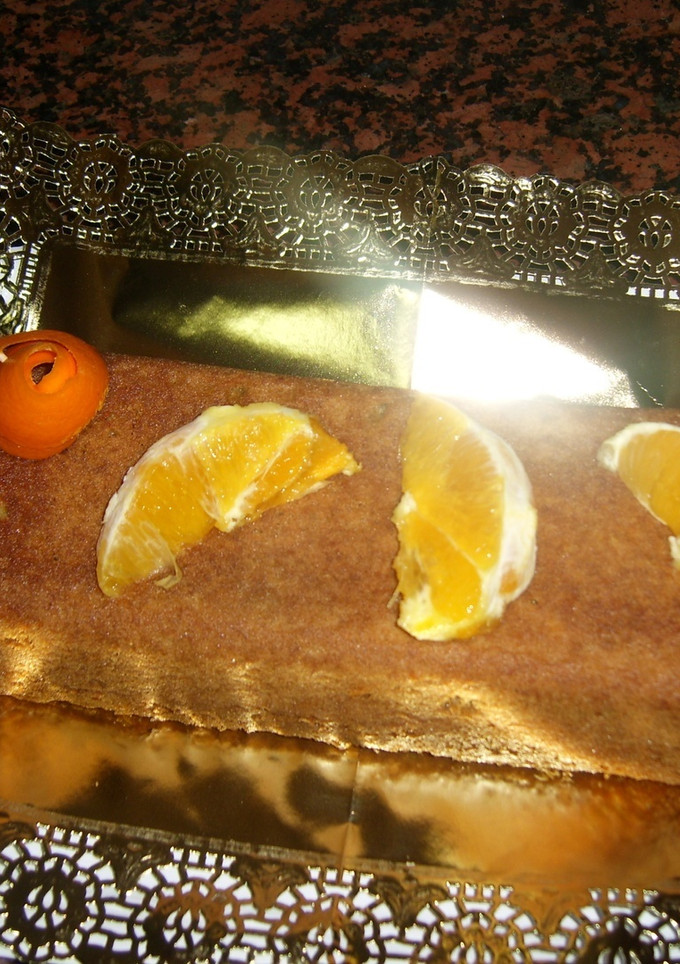 Una foto de Bizcocho de café con salsa de naranja