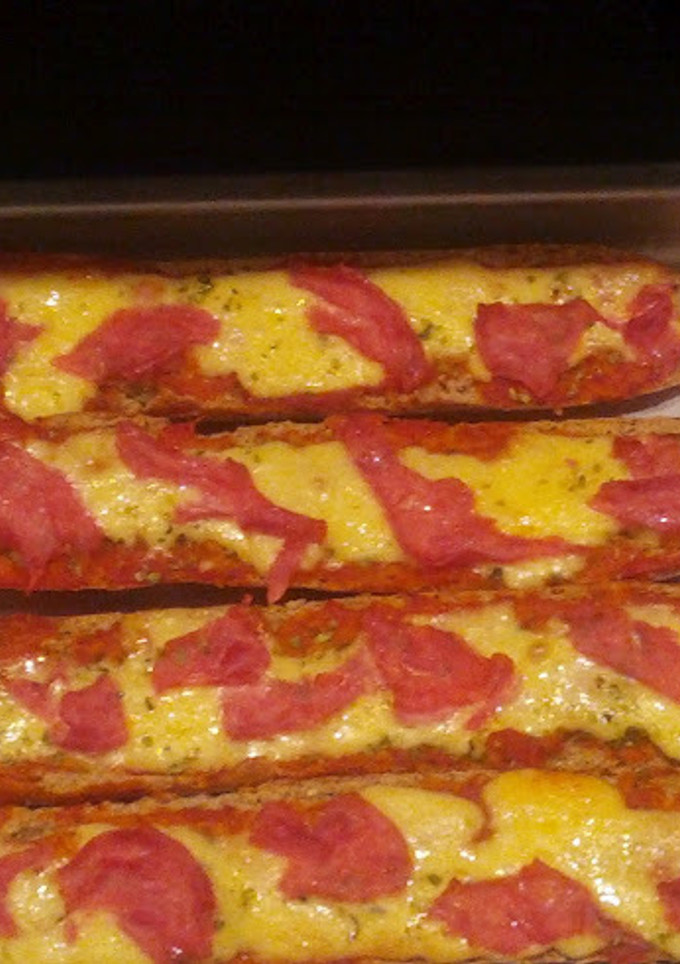 Una foto de Pizzas de pan caseras