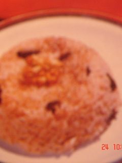 Una foto de Arroz negro con pasas