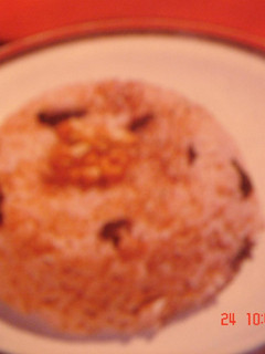 Una foto de Arroz negro con pasas
