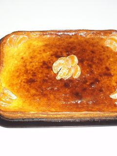 Una foto de Tarta de queso con naranja y mermelada de frutos del bosque