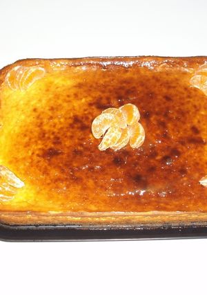 Una foto de Tarta de queso con naranja y mermelada de frutos del bosque
