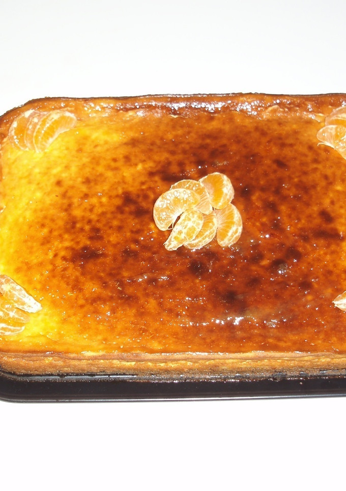 Una foto de Tarta de queso con naranja y mermelada de frutos del bosque