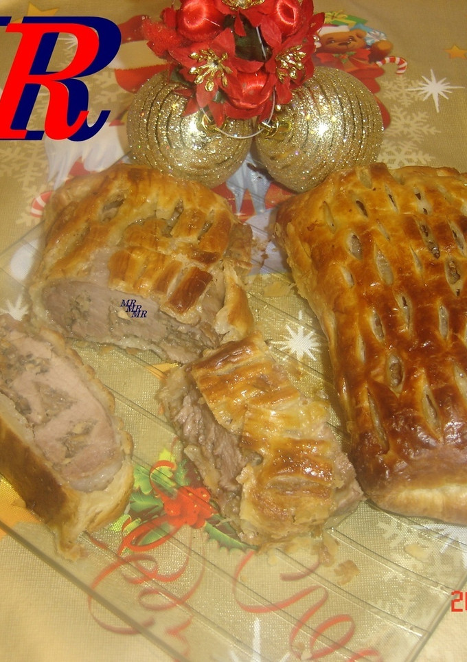 Una foto de Solomillo ibérico hojaldrado con setas o champiñones