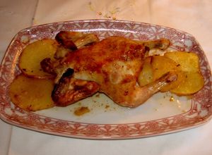 Foto principal de Coquelet al horno con patatas panaderas