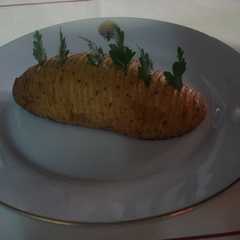 Una foto de Papas Hasselback