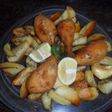 Muslos de pollo rebozados con papas al orégano