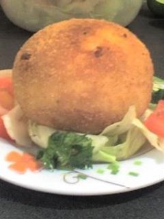 Una foto de Arancini o arancine