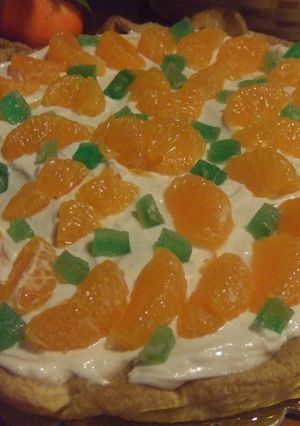 Una foto de Tarta de nueces con queso crema y mandarinas