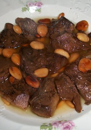 Una foto de Niscalos con almendras y piñones al Cava