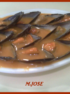 Una foto de Mejillones en salsa de tomate y pimiento