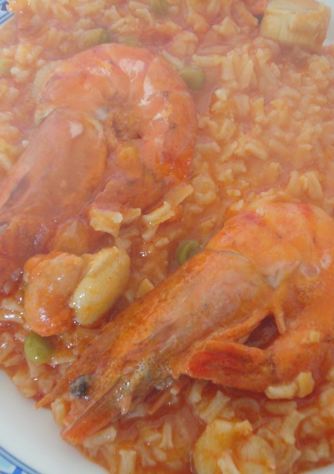 Una foto de Arroz caldoso con vieiras y langostinos