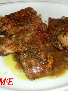 Una foto de Conejo al horno en salsa de vino tinto