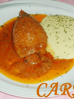 Una foto de Calamares rellenos de rape y langostinos