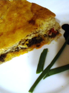 Una foto de Empanada de morcilla y pimientos