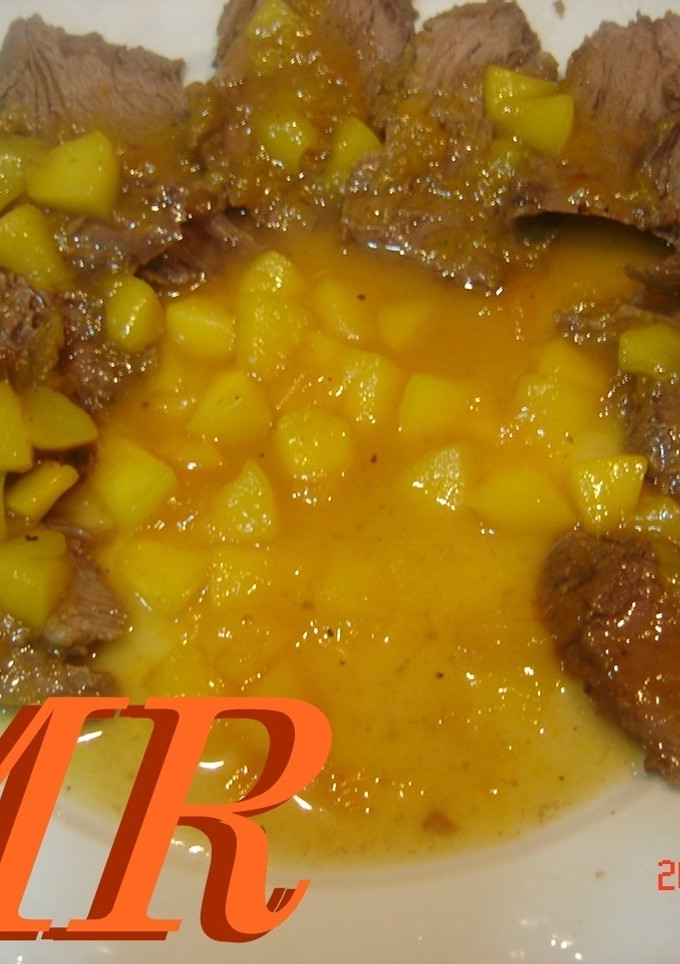 Una foto de Lomo con salsa de naranja y melocoton
