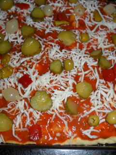 Una foto de Pizza al orégano con pikles