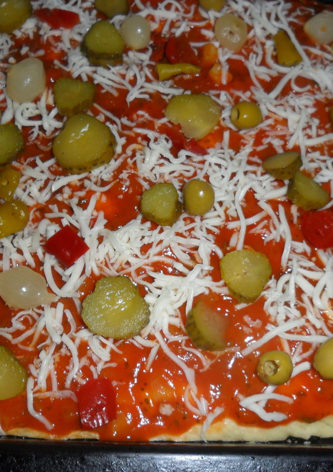 Una foto de Pizza al orégano con pikles