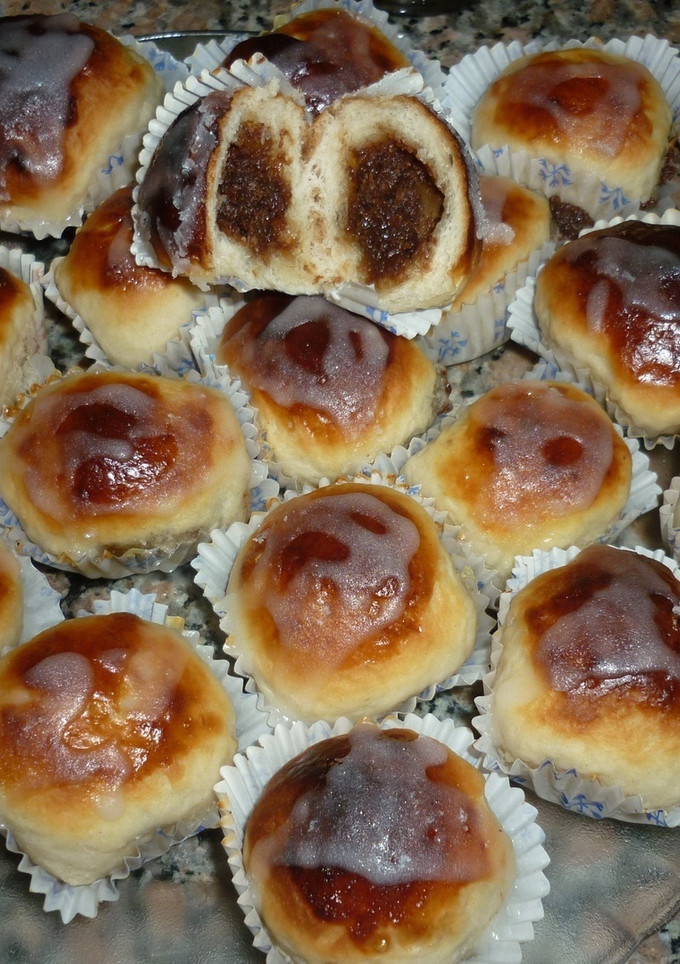 Una foto de Bollitos de limón rellenos con coco y dulce de leche