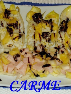 Una foto de Endivias rellenas de arroz, piña y piñones