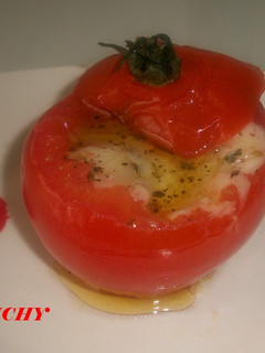 Una foto de Tomates gratinados con queso de cabra