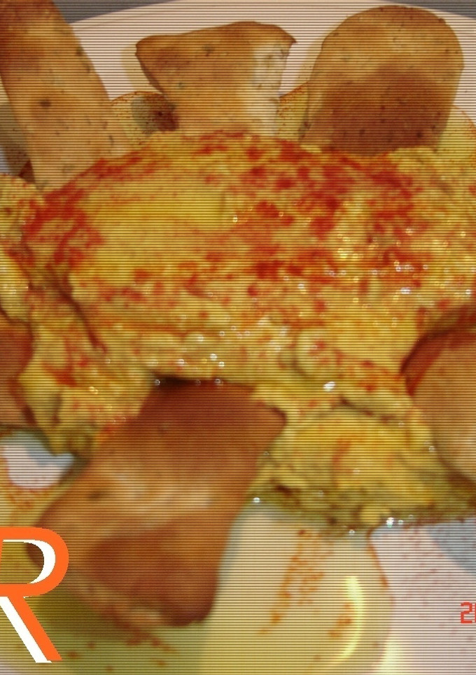 Una foto de Hummus con su bastón de comino