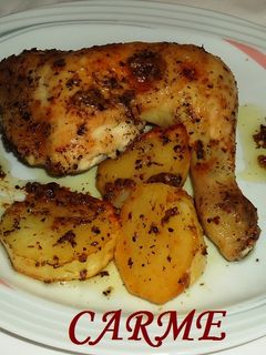 Una foto de Pollo asado al limón con hierbas aromáticas y patatas