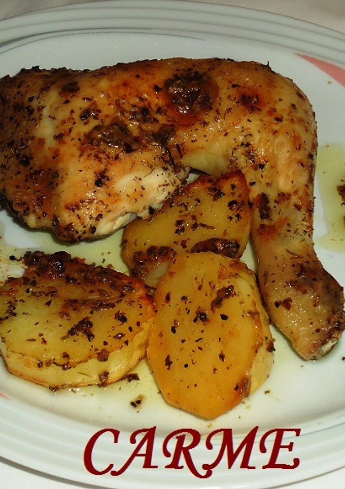 Una foto de Pollo asado al limón con hierbas aromáticas y patatas