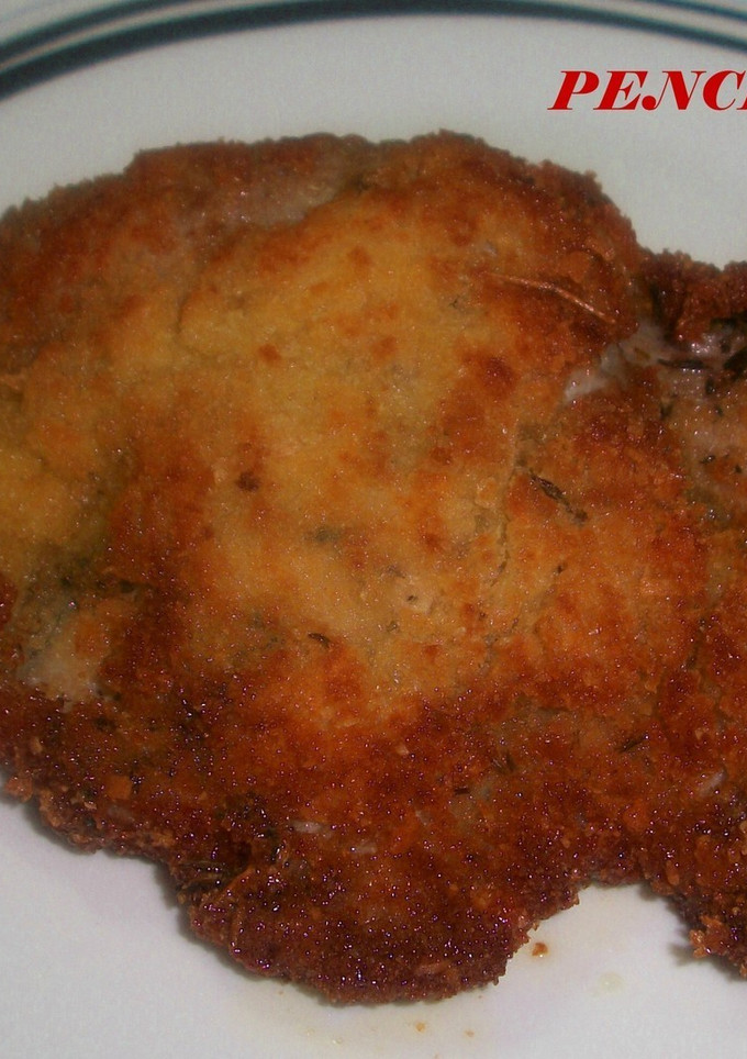 Una foto de Filetes de cerdo adobados empanados