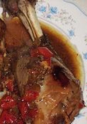 Una foto de CORDERO ASADO