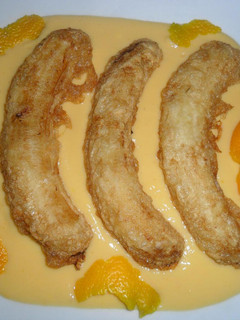 Una foto de Plátanos fritos con crema de naranja