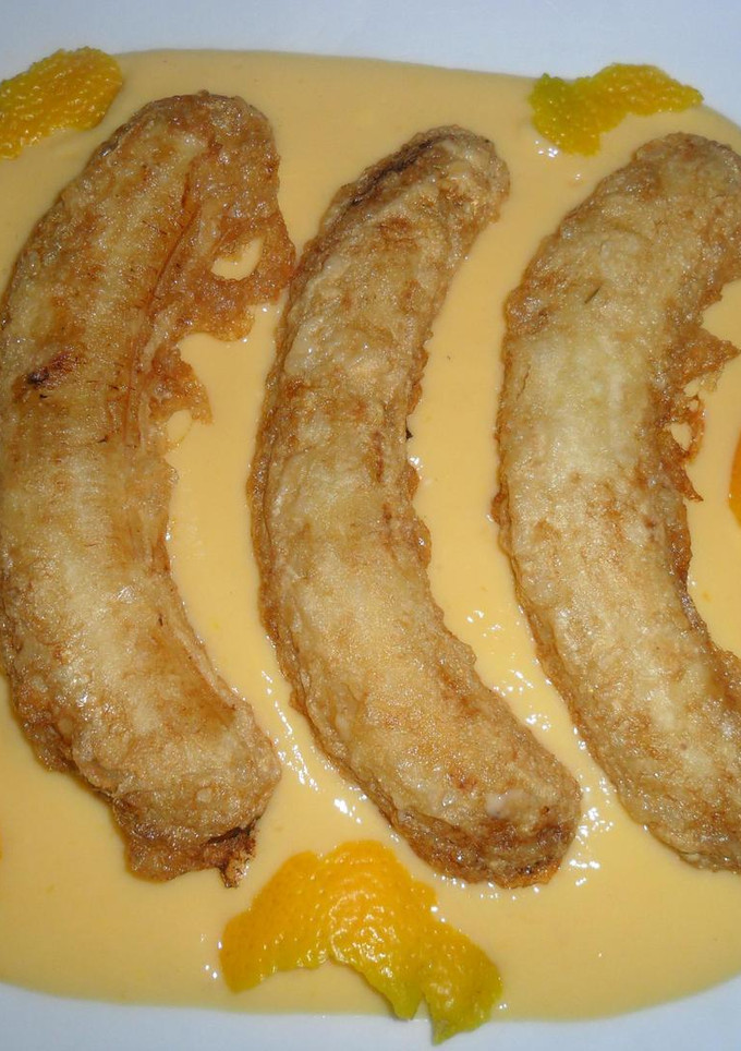 Una foto de Plátanos fritos con crema de naranja