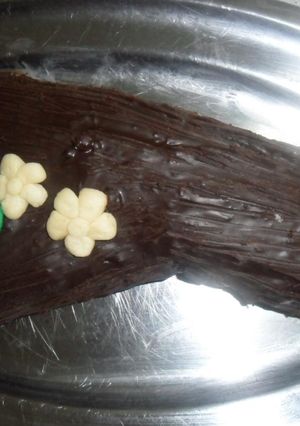 Una foto de Tronco de dulce de leche con crema de chocolate amargo