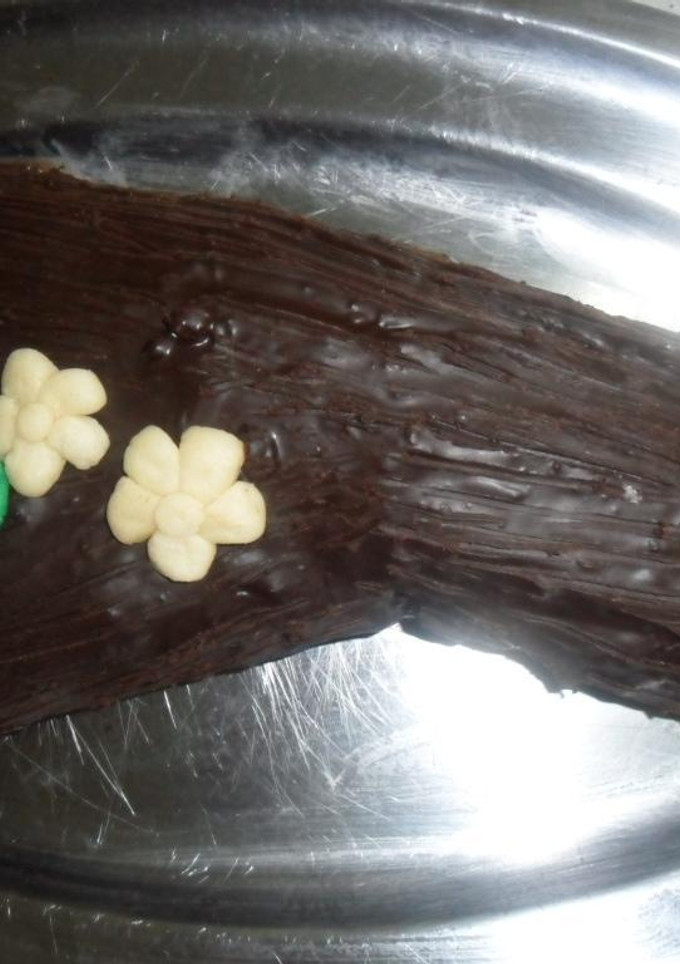 Una foto de Tronco de dulce de leche con crema de chocolate amargo