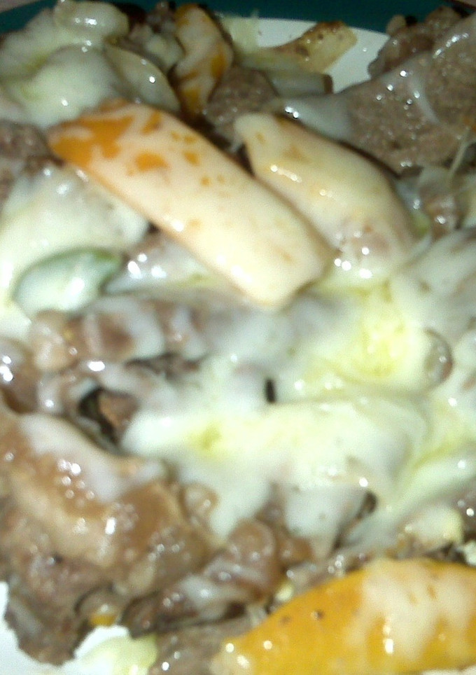 Una foto de Carne con pimientos y queso