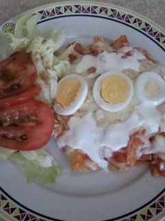 Una foto de Entomatadas rellenas de pollo