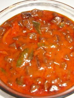 Una foto de Sangre frita con pimientos y tomates de Lorca