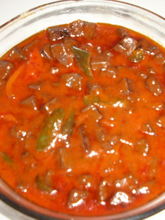 Una foto de Sangre frita con pimientos y tomates de Lorca