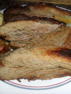 Foto principal de Vacío y chorizos al horno con salsa criolla