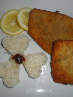 Una foto de Milanesas de mondongo al ajo y perejil con arroz blanco