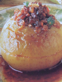 Una foto de Manzanas asadas con frutos secos y miel de romero