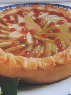 Una foto de Tarta de peras y granada