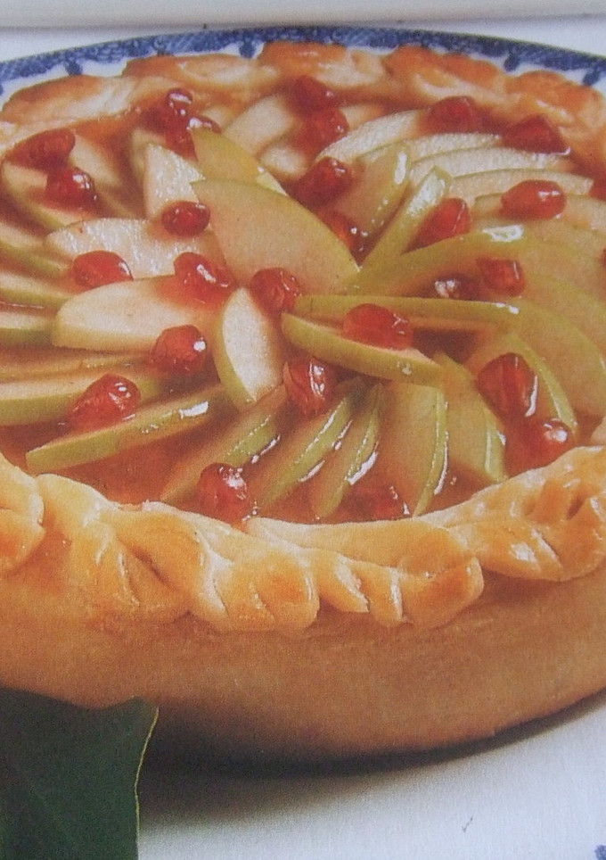 Una foto de Tarta de peras y granada