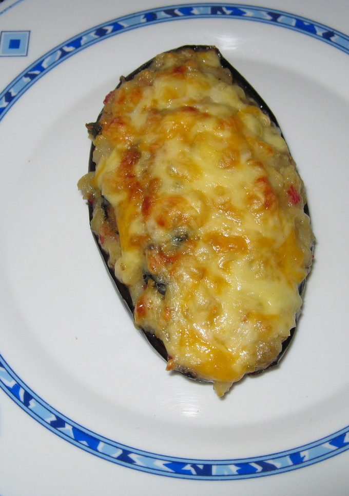Una foto de Berenjenas rellenas de mejillones y gambas