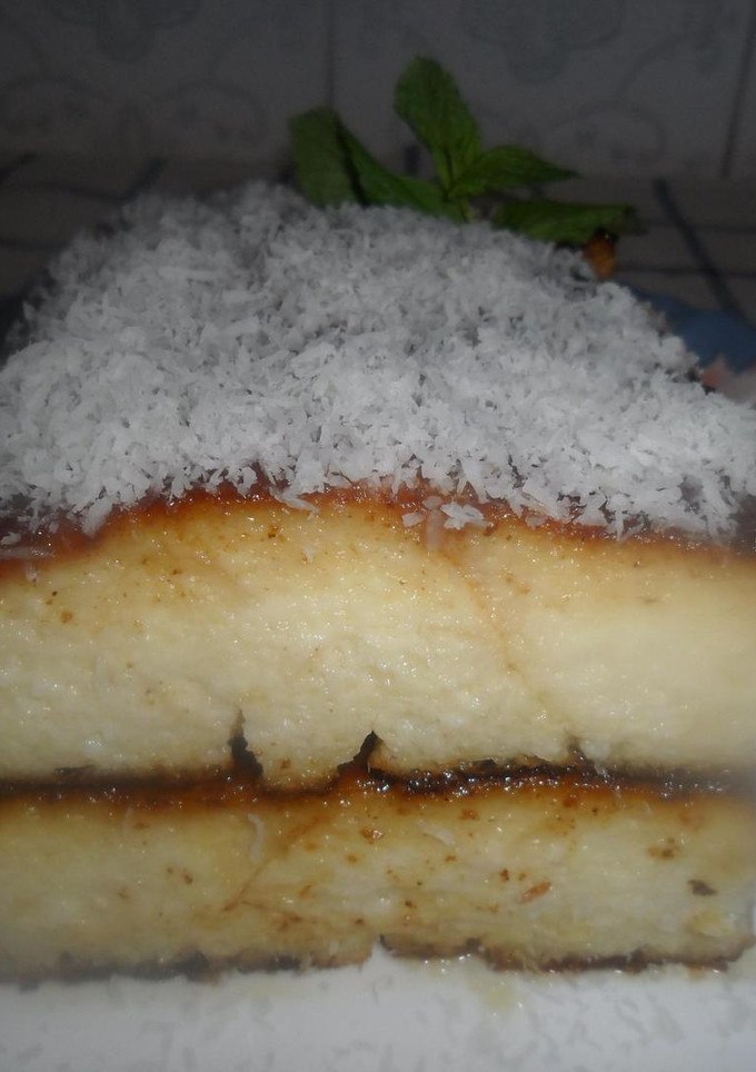 Una foto de Budín de pan con queso crema y coco