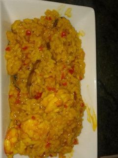 Una foto de Arroz con gambones y almejas de carril