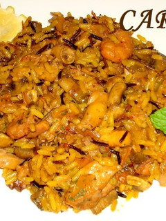 Una foto de Arroz salvaje con champiñones y chipirones