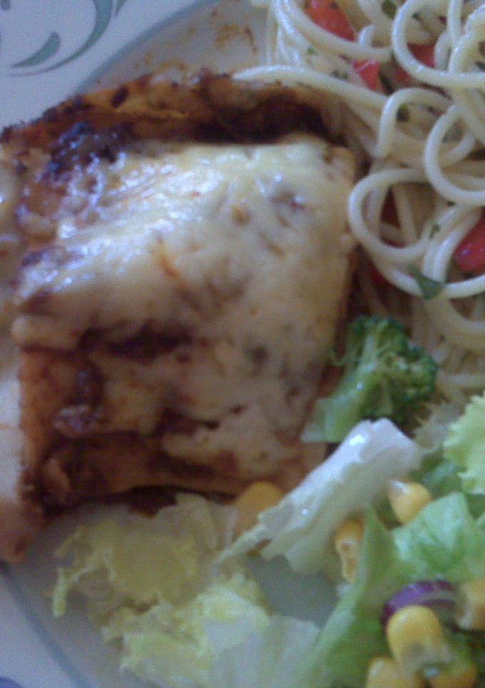 Una foto de Crepas con mole poblano