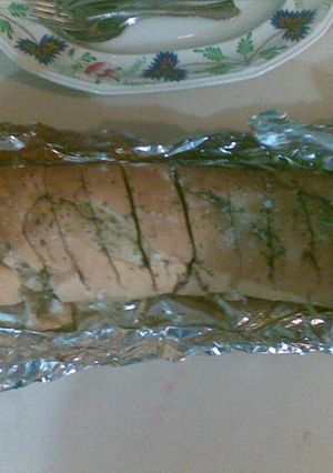 Una foto de Pan de ajo, orégano, perejil y parmesano