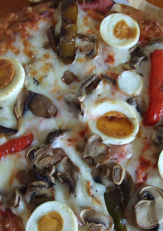 Una foto de Pizza integral de jamón asado